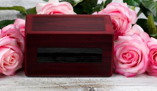 cremation box with pink roses around it