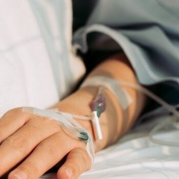 terminal illness person with iv in arm