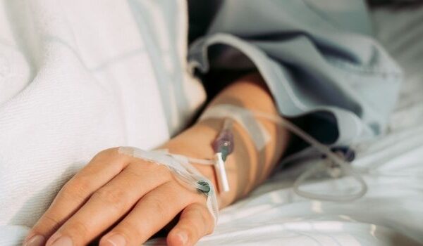 person with iv in arm