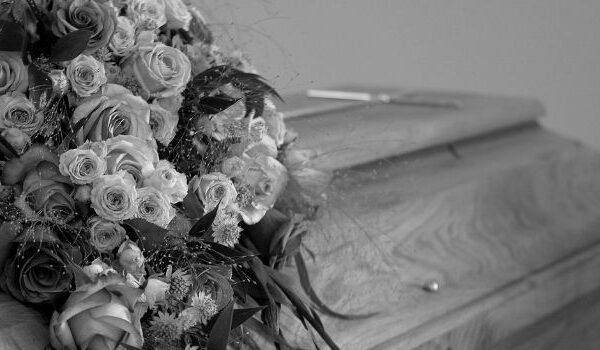 casket and flowers in grey