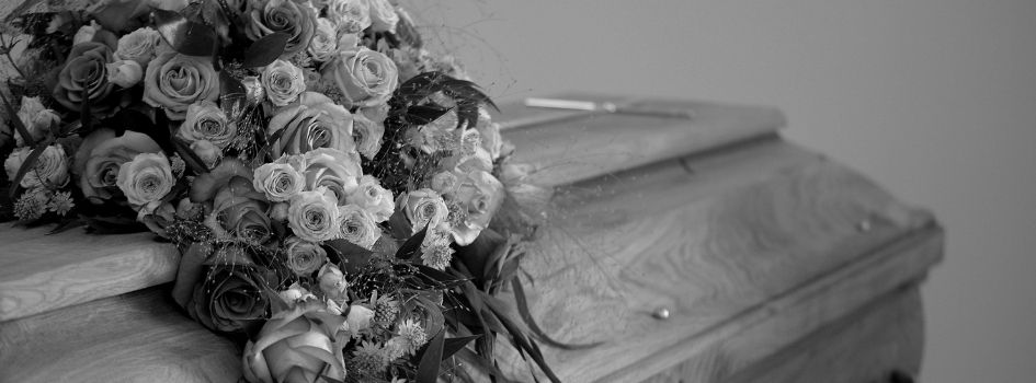 casket and flowers in grey