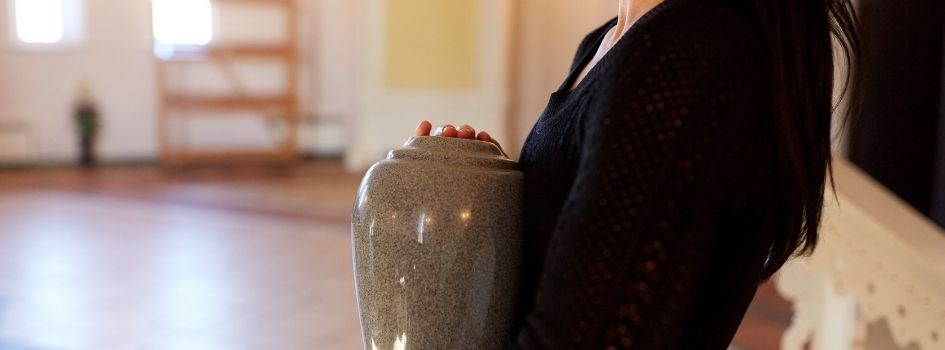 woman holding urn